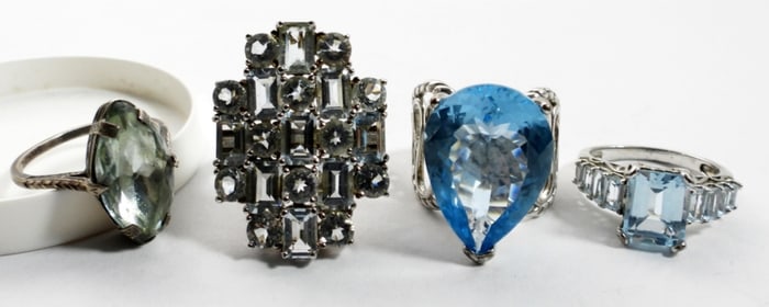 (4) STERLING BLUE GEMSTONE RINGS