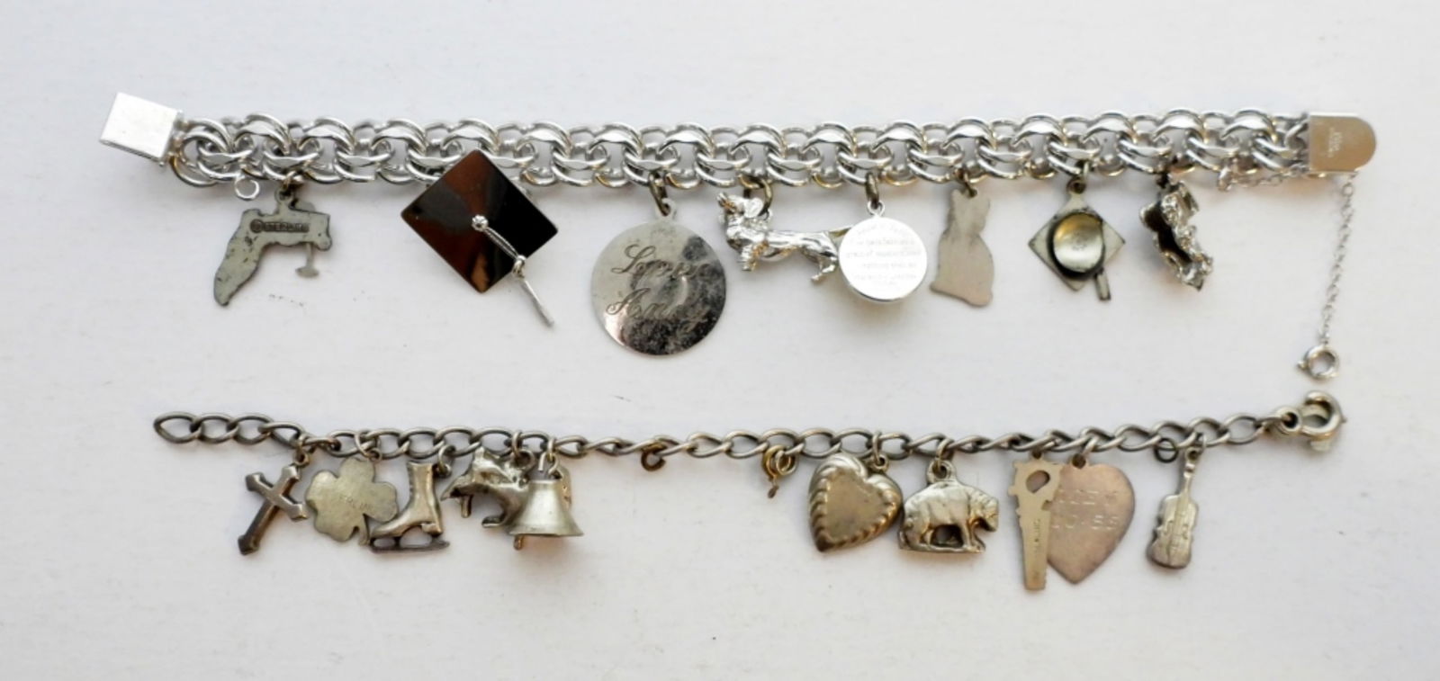 (2) STERLING SILVER CHARM BRACELETS: 43.3 DWT - 7.5"