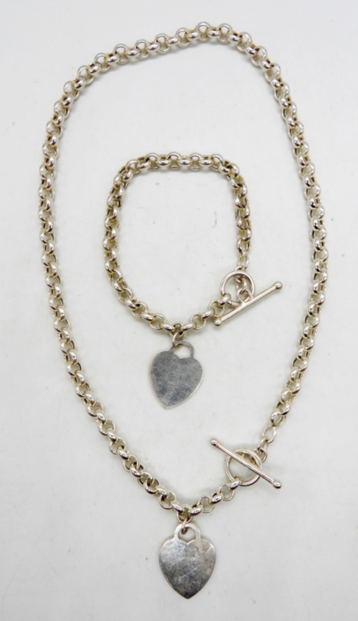 STERLING HEART NECKLACE AND BRACELET SET: 27DWT, BOTH STAMPED 925, NECKLACE 19" LONG, BRACELET 8" LONG, BOTH WITH TOGGLE CLASP