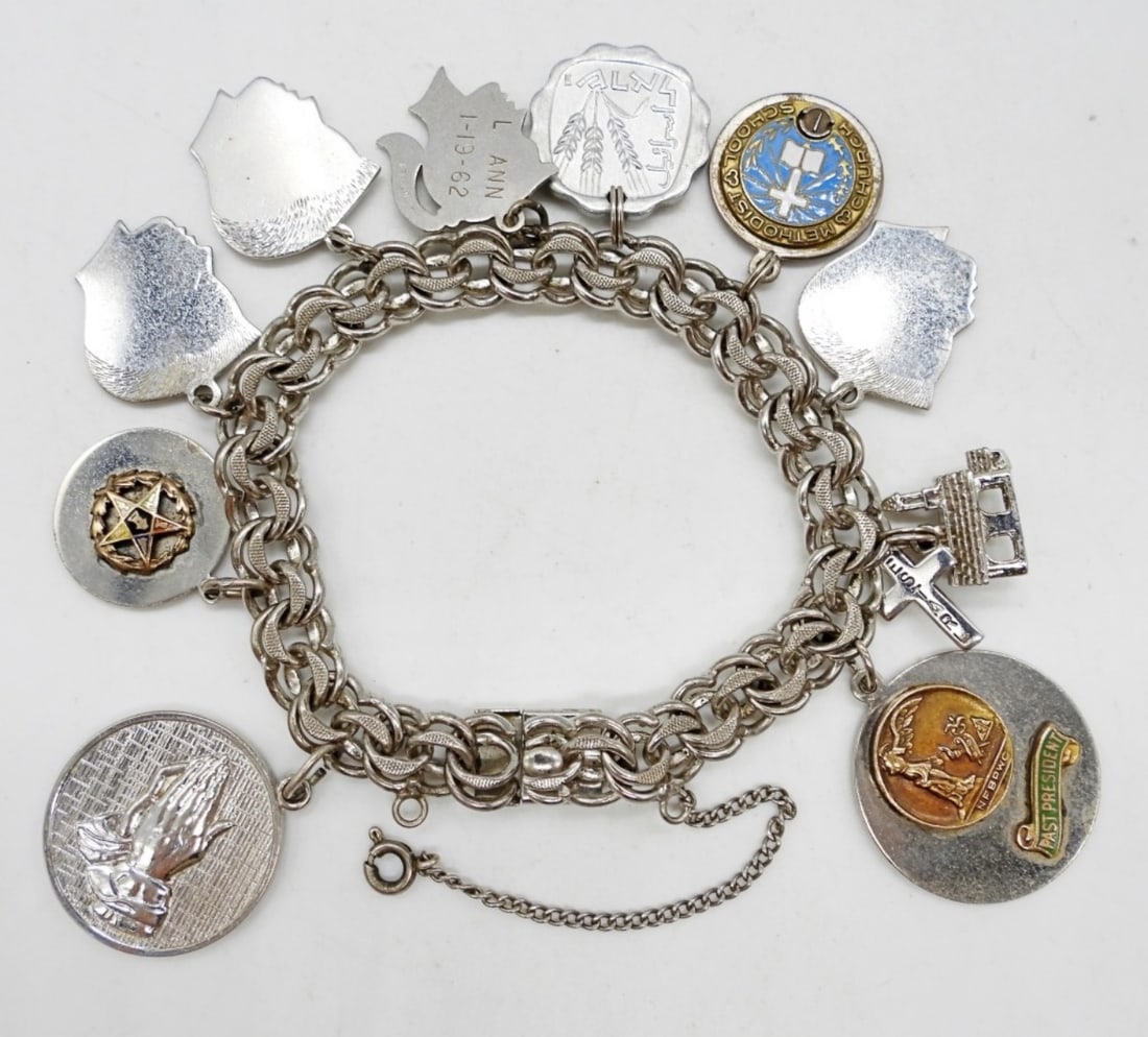 VINTAGE STERLING CHARM BRACELET: VINTAGE STERLING CHARM BRACELET, 7" WITH 10 CHARMS. 34 DWT