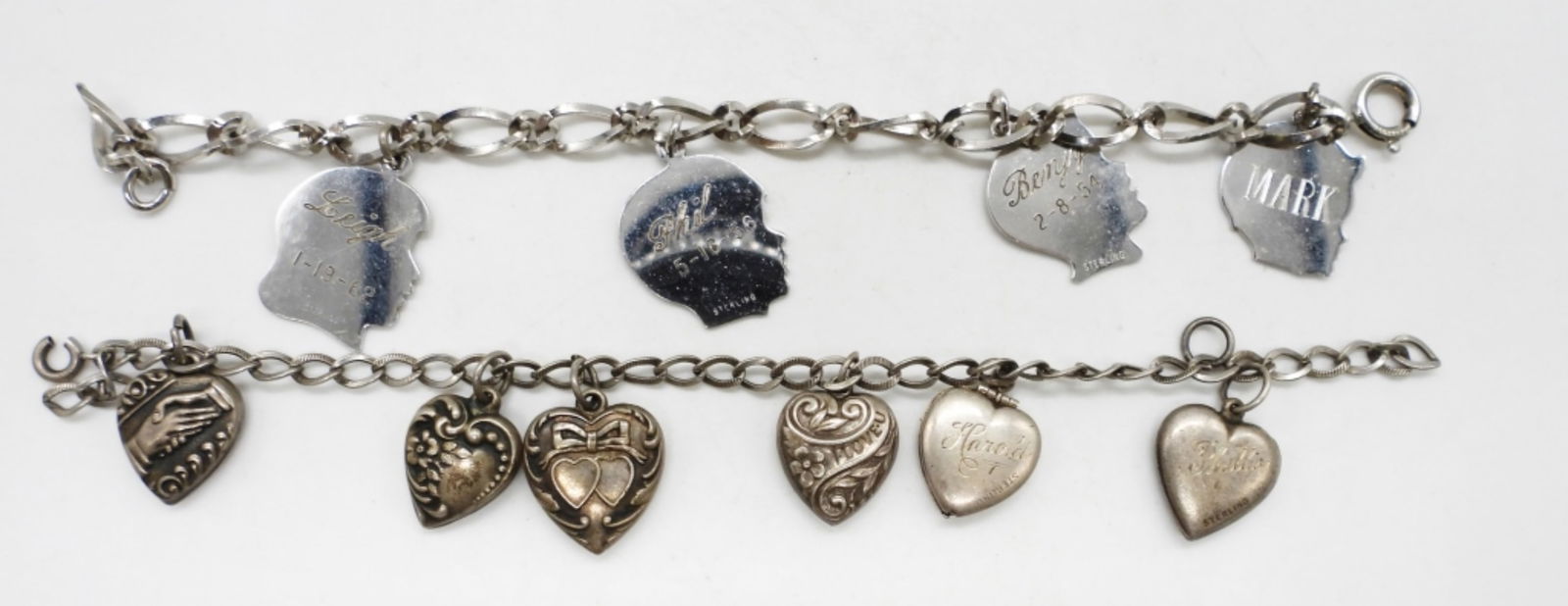 2 VINTAGE STERLING CHARM BRACELETS: 2 VINTAGE STERLING CHARM BRACELETS WITH ENGRAVED CHARMS. 7". 18.9 DWT