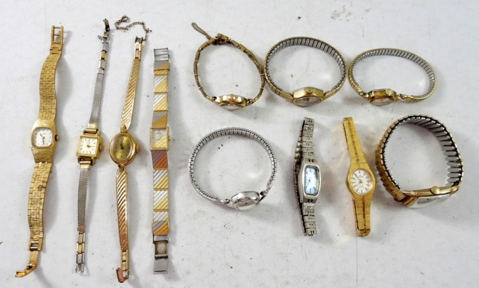 11 LADIES FASHIONABLE WIND UP WATCHES: (3) SEIKO, (3) ELGIN,(2)WITTNAUER,(1)BULOVA,(1)HAMILTON,(1)W ALTHAM. VARIES BANDS, BOTH GOLD TONE & SILVER TONE."NOT TESTED AS TO WORKING OR NOT"