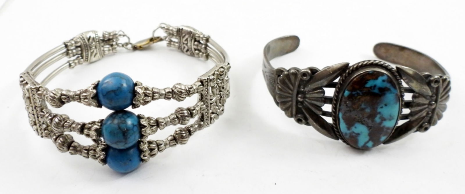 2 STERLING CUFF BRACELETS: 2 STERLING CUFF BRACELETS WITH TURQUOISE LIKE STONES.33.4 DWT