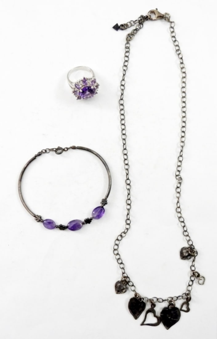 SIZE 6 STERLING RING WITH PURPLE STONE & MORE: SIZE 6 STERLING RING WITH PURPLE STONE,6 IN 925 BRACELET WITH PURPLE STONES,AND A 20 IN STERLING NECKLACE WITH HEART CHARMS.14.3 DWT