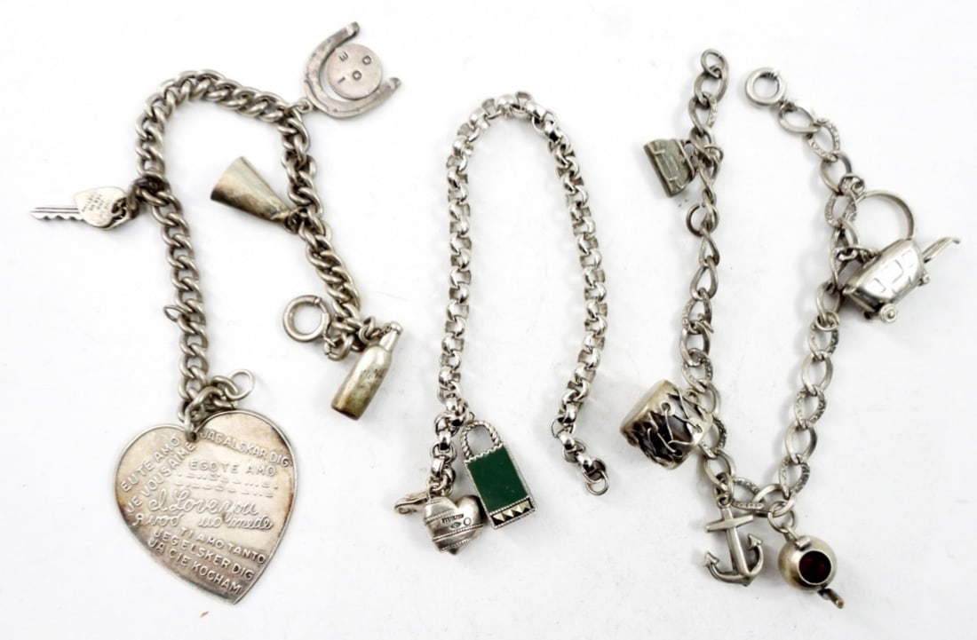 (3) STERLING CHARM BRACELETS WITH CHARMS: (3) STERLING CHARM BRACELETS WITH 12 CHARMS TOTAL .38.2 DWT
