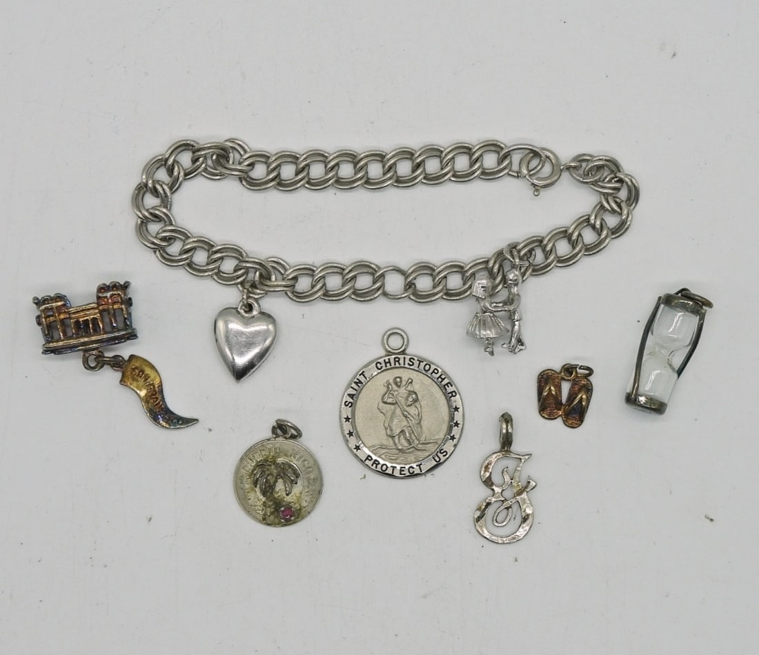 STERLING CHARM BRACELET WITH 8 CHARMS: STERLING CHARM BRACELET 6" WITH 8 CHARMS 15.5 DWT