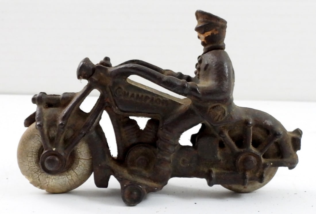 ANTIQUE CAST IRON 1930's POLICE MOTORCYCLE: ANTQUE CAST IRON 1930's POLICE MOTORCYCLE-CHAMPION-HUBLEY RUBBER TIRES (TIRES ARE NOW HARD). 5" LONG, 4" TALL.