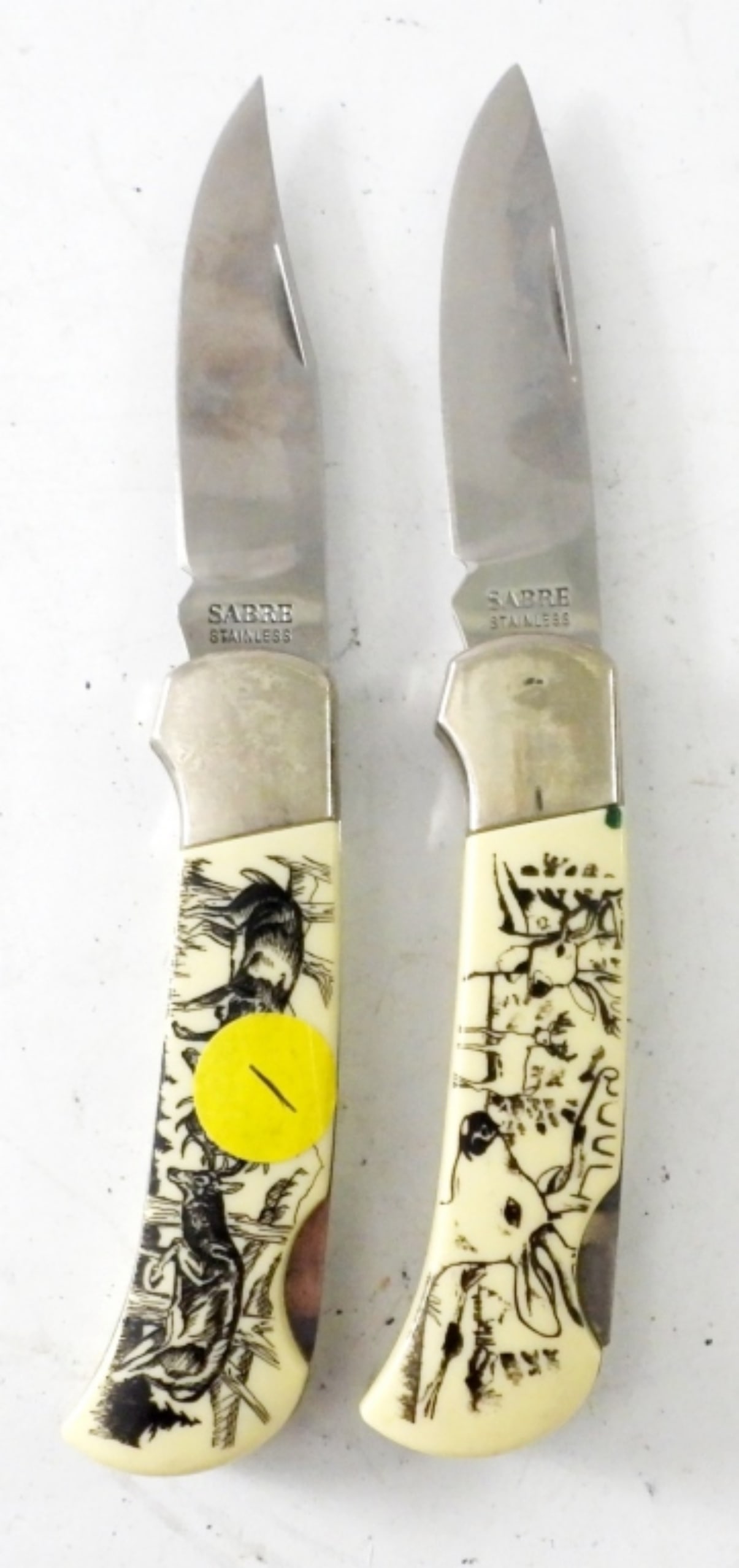 2 DEER PRINT SABRE LOCK BACK POCKET KNIVES (1 of 3)