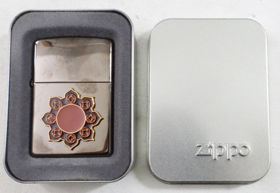 2005 SUNBURST ZIPPO: SEALED AND IN TIN ZIPPO BOX