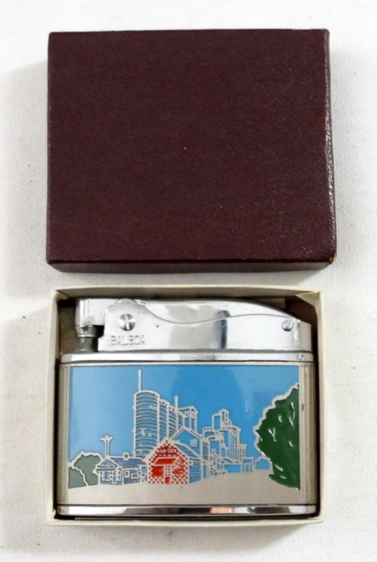 VINTAGE WELLINGTON BALBOA UNFIRED LIGHTER: VINTAGE WELLINGTON BALBOA UNFIRED LIGHTER ADVERTISEMENT ON ONE SIDE AND CITY SCAPE ON THE OTHER