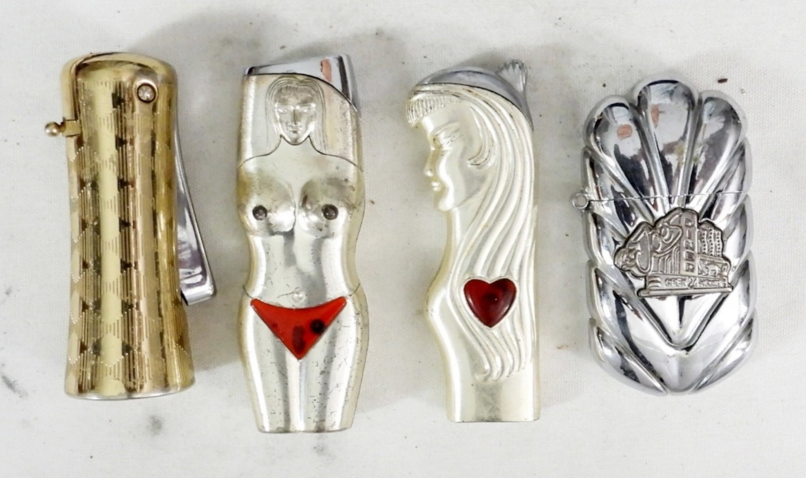 (4) UNUSUAL BUTANE LIGHTERS: (4) UNUSUAL BUTANE LIGHTERS, SILVERTONE NUDE WOMAN SHAPE, SILVERTONE WOMAN AND HEART, JOES DINER SILVERTONE, RONSON GOLDTONE CYLINDER