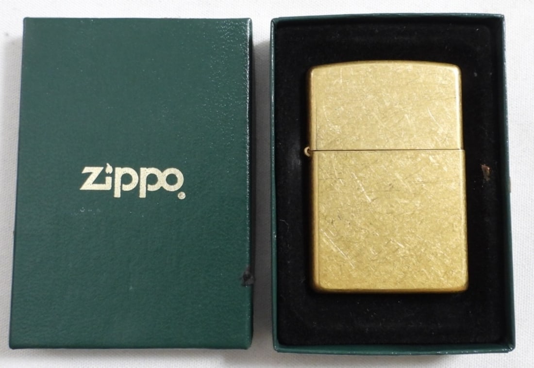 2004 UNFIRED BRASS ZIPPO IN BOX: 2004 UNFIRED BRASS ZIPPO IN A GREEN ZIPPO BOX