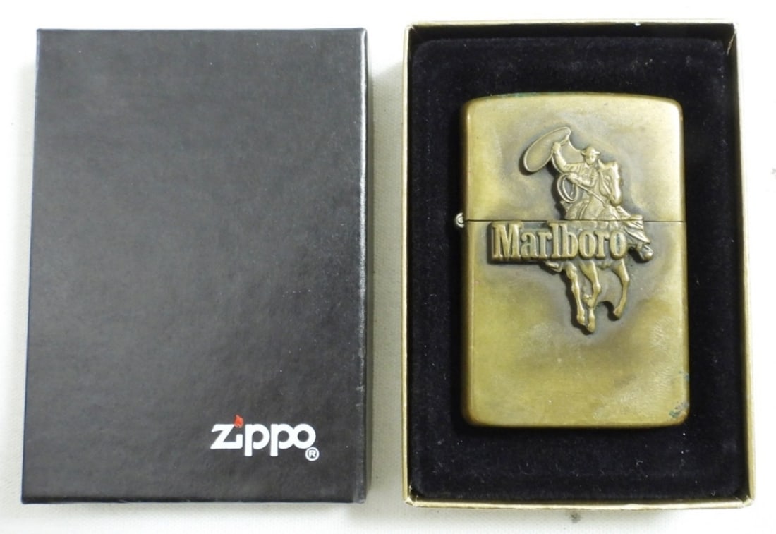 1986 (FIRED) BRASS MARLBORO COWBOY ZIPPO: 1986 (FIRED) BRASS MARLBORO COWBOY ZIPPO, IN BOX