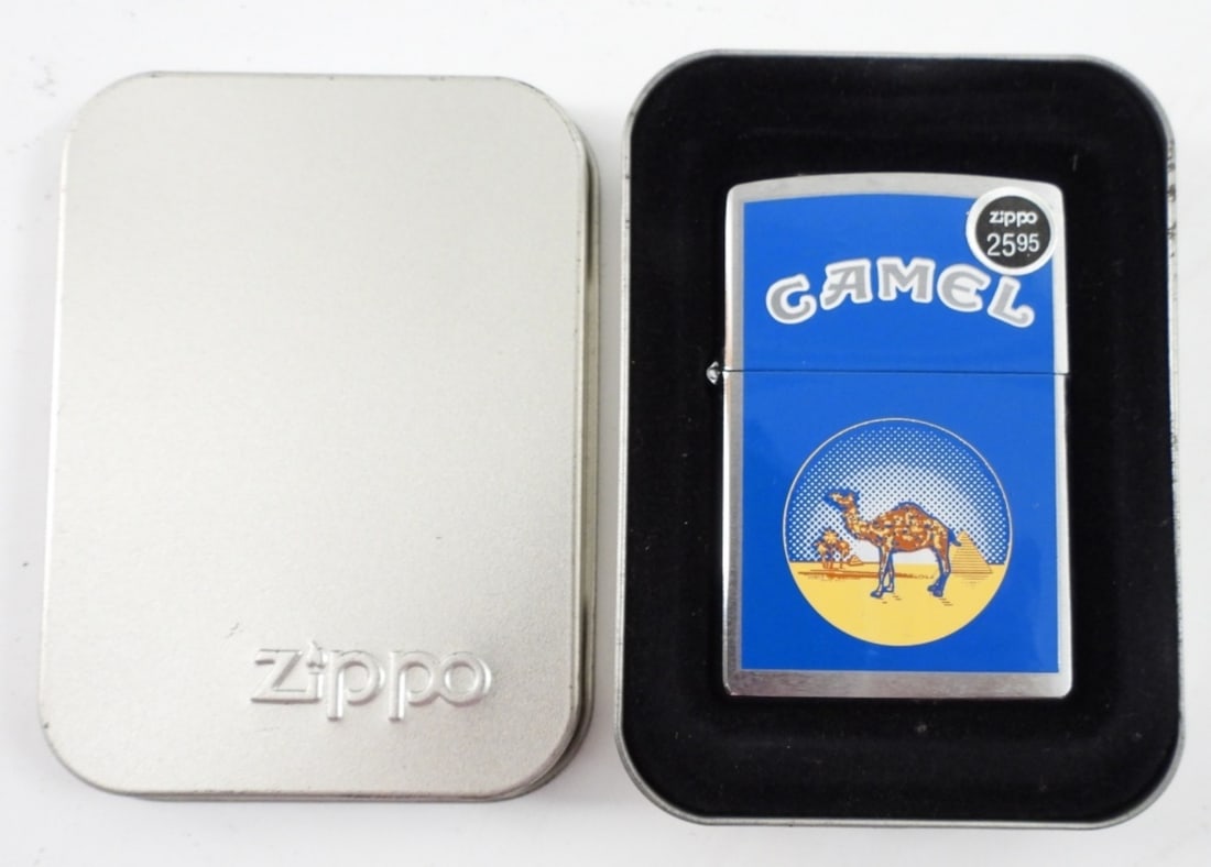 1999 SEALED CAMEL CIRCLE BLUE ZIPPO: 1999 SEALED CAMEL CIRCLE BLUE ZIPPO IN TIN AND SLEEVE