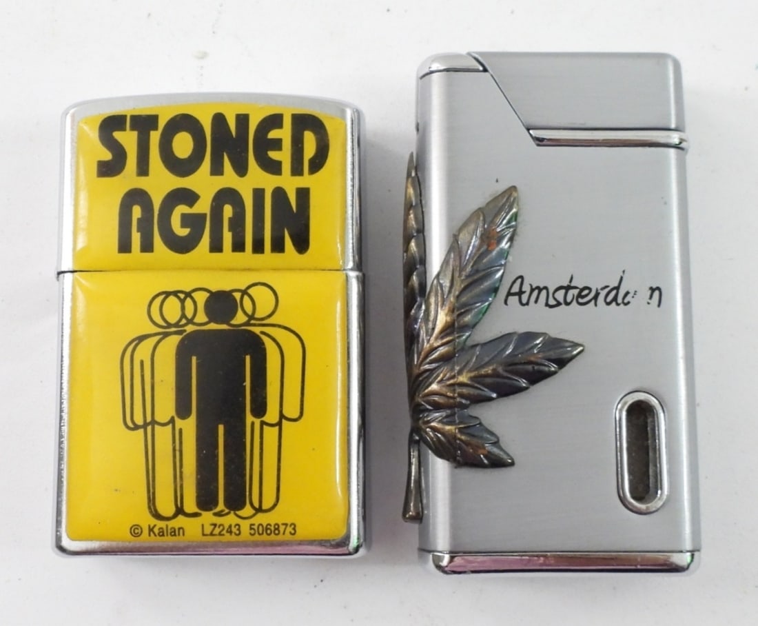 (2) MARIJUANA LIGHTERS: TWO MARIJUANA LIGHTERS, "STONED AGAIN" & "AMSTERDAM" WITH POT LEAF.
