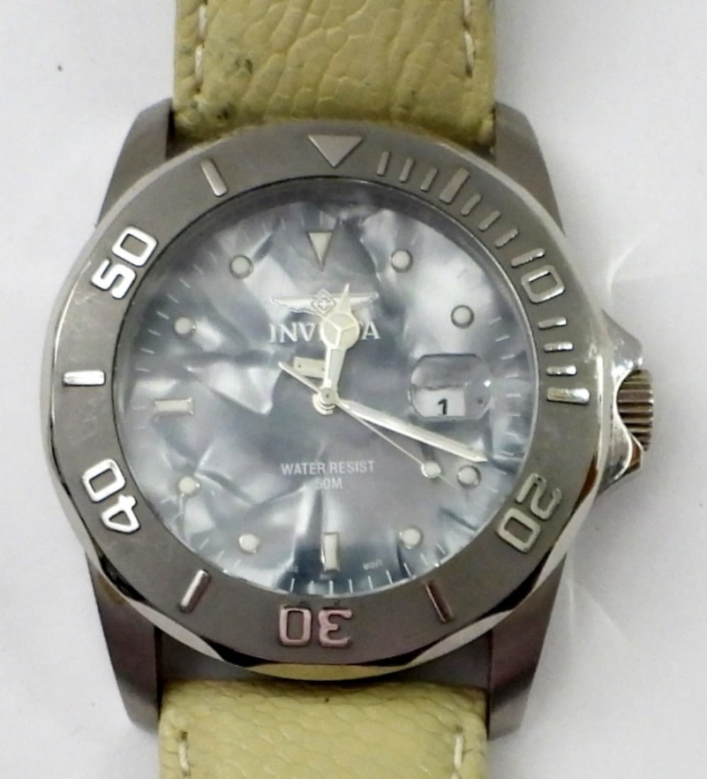 INVICTA MODEL #0009 STAINLESS STEEL WATCH: INVICTA MODEL #0009 STAINLESS STEEL, WATER RESISTANT, GENUINE CREAM COLOR OSTRICH BAND WATCH (ISA CAL 2321) 0 JEWELS CHINA FAR EAST ASS'Y INVICTA WATCH GROUP