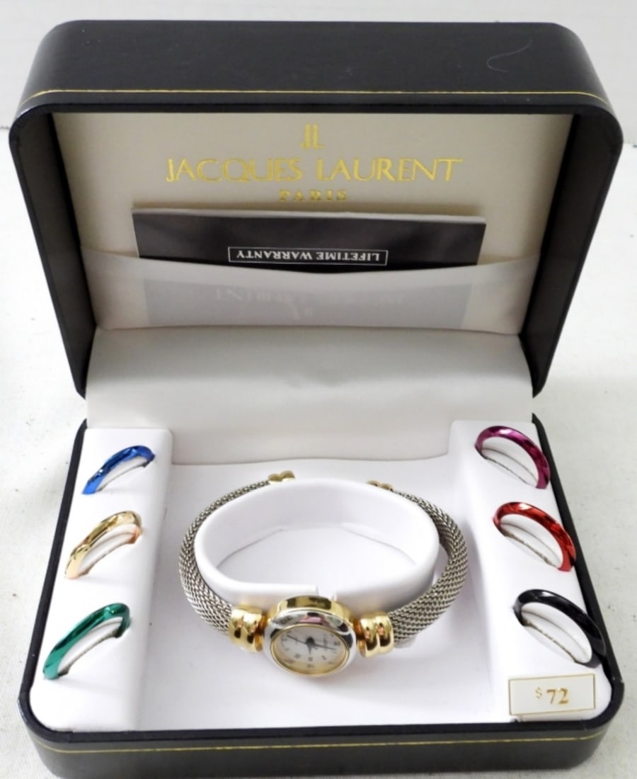 JACQUES LAURENT PARIS LADIES CUFF WATCH: JACQUES LAURENT PARIS LADIES CUFF WATCH WITH INTERCHANGEABLE FACES, GOLD & SILVER TONE IN ORIGINAL BOX WITH PAPERS . NOT TESTED AS TO WORKING OR NOT
