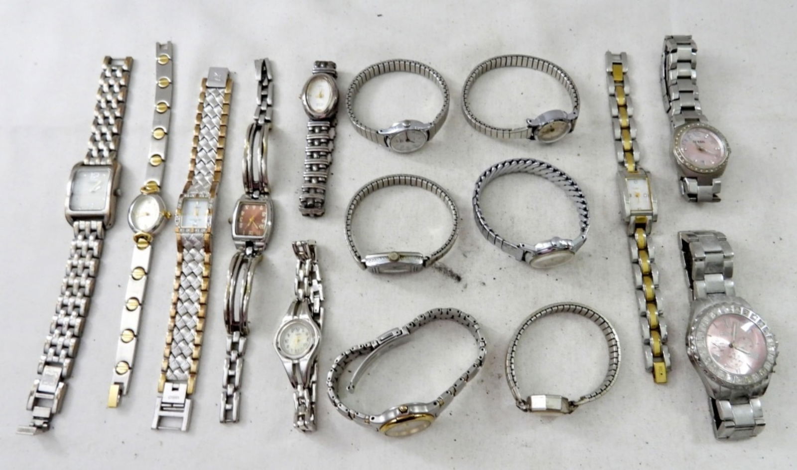 (15) WOMENS MIX VINTAGE & MODERN: UNTESTED (15) WOMENS MIX VINTAGE & MODERN, ELGIN, TIMEX, FOSSIL, ANNE KLEIN, MIX OF SILVERTONE AND TWO TONE, METAL LINK W/ FOLDING CLASP AND METAL STRETCH BANDS