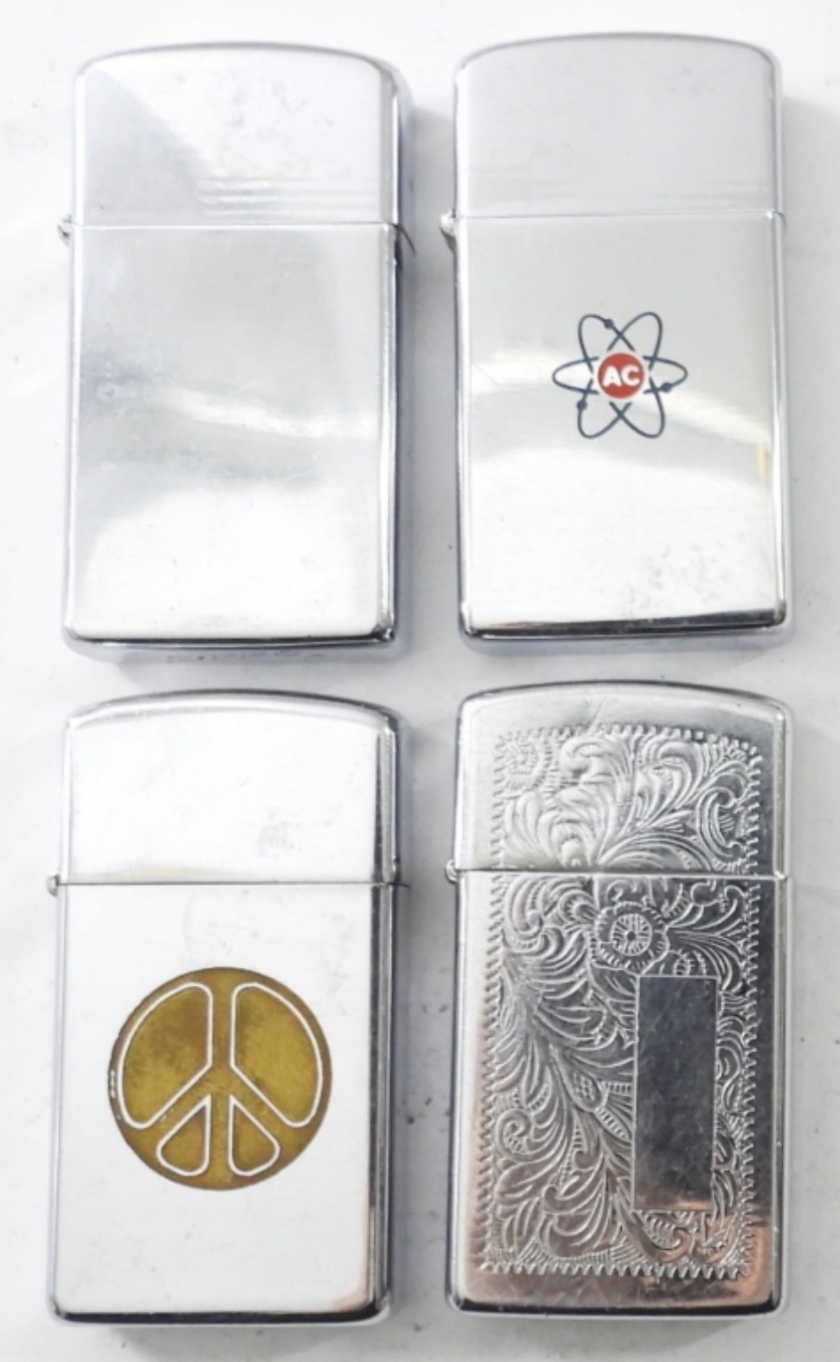 (4) SILVERTONE SLIM ZIPPOS (1 of 4)