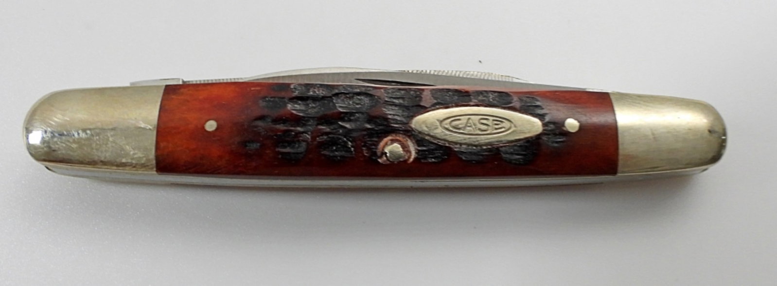 CASE XX 10 DOT 06263F SSP EISENHOWER: RED/BROWN BONE FOLDING KNIFE - LIKE NEW