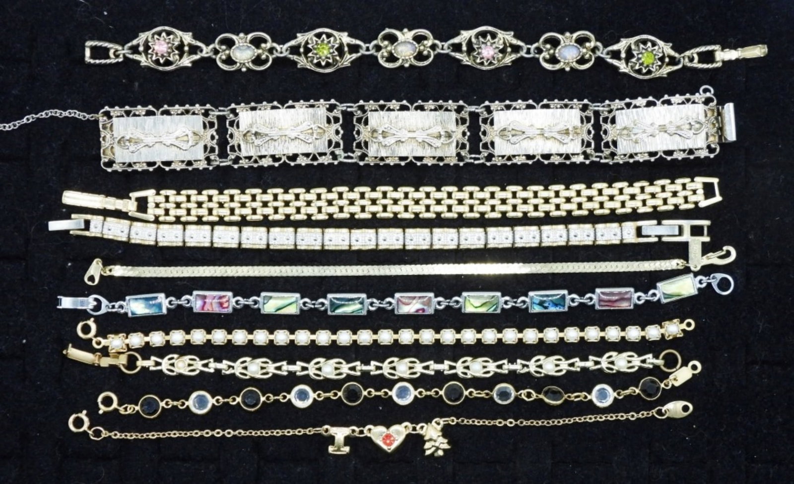(10)FUN MODERN BRACELETS: TEN FUN GOLD AND SILVER TONE BRACELETS WITH VARIOUS GEMSTONES. 7-8"