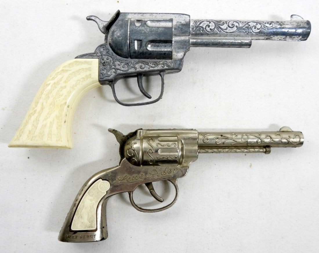 (2) VINTAGE TOY CAP GUNS: (2) VINTAGE TOY GUNS , 1 PONY BOY CAP GUN , 1 BUZZ HENRY LONE RIDER CAP GUN