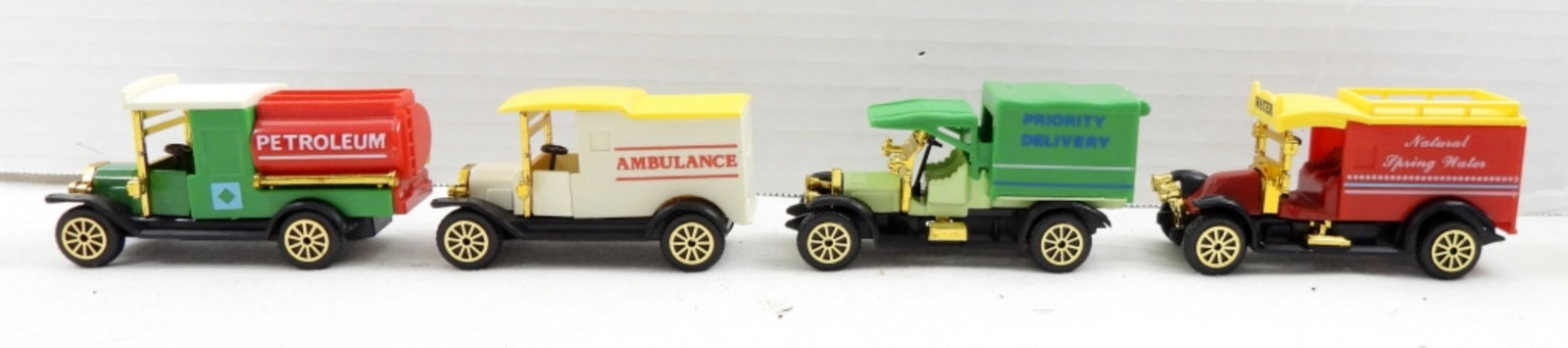 (4) CLASSIC TRUCKS COLLECTORS SET - NEW: in ORIGINAL BOX LIKE NEW - WATER WAGON, DELIVERY VAN, MODEL T TANKER, MODEL T AMBULANCE - AVG 3"-4" SIZE