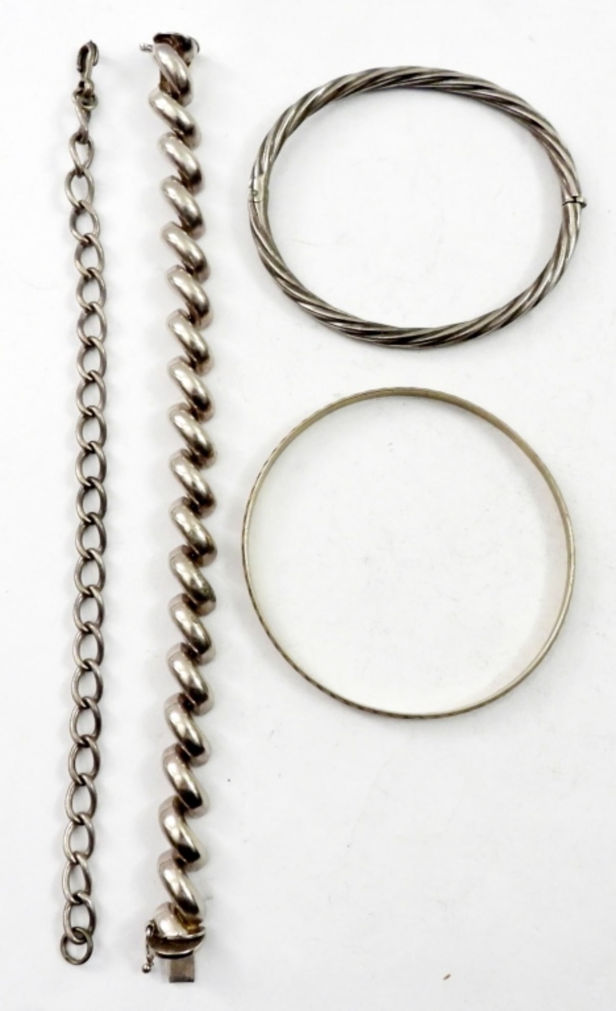 4 STERLING FASHION BRACELETS: (2) 7 IN STERLING CHAIN BRACELETS,2 BANGLE BREACELETS. 33.8 DWT