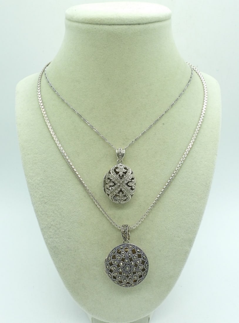 (2) STERLING LOCKETS: TWO STERLING LOCKETS. THESE ARE NOT TYPICAL LOCKETS, PLEASE SEE PHOTOS. STERLING CHAINS ARE 18". 22 DWT