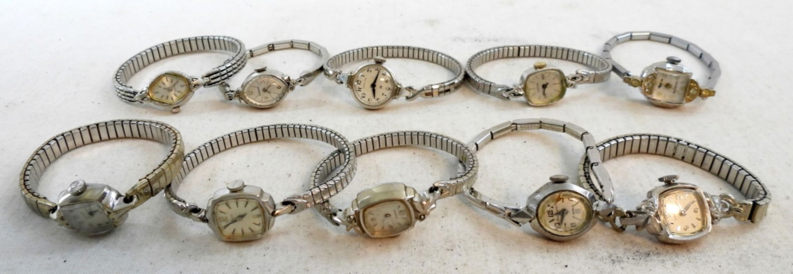 (10)LADIES SILVER STRETCH BAND WATCHES: UNTESTED, SKINNY BANDS, WHITE DIALS, HAMILTON, BULOVA, WITTNAUER, CARAVELLE, CROTON,