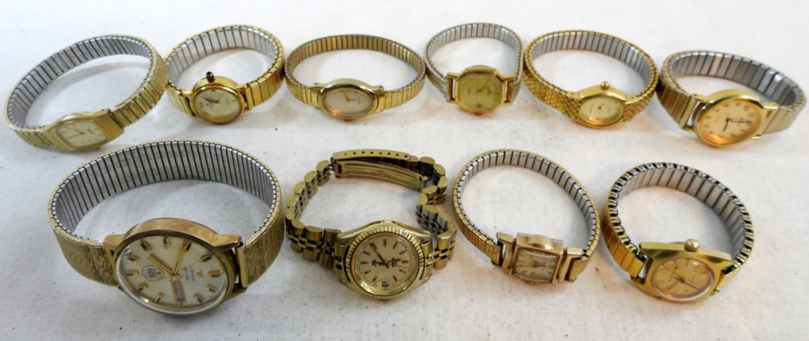 (10) LADIES GOLD STRETCH BAND WATCHES: UNTESTED. JEMIS, WITTNAUER, SEIKO, TIMEX, BULOVA, WALTHAM