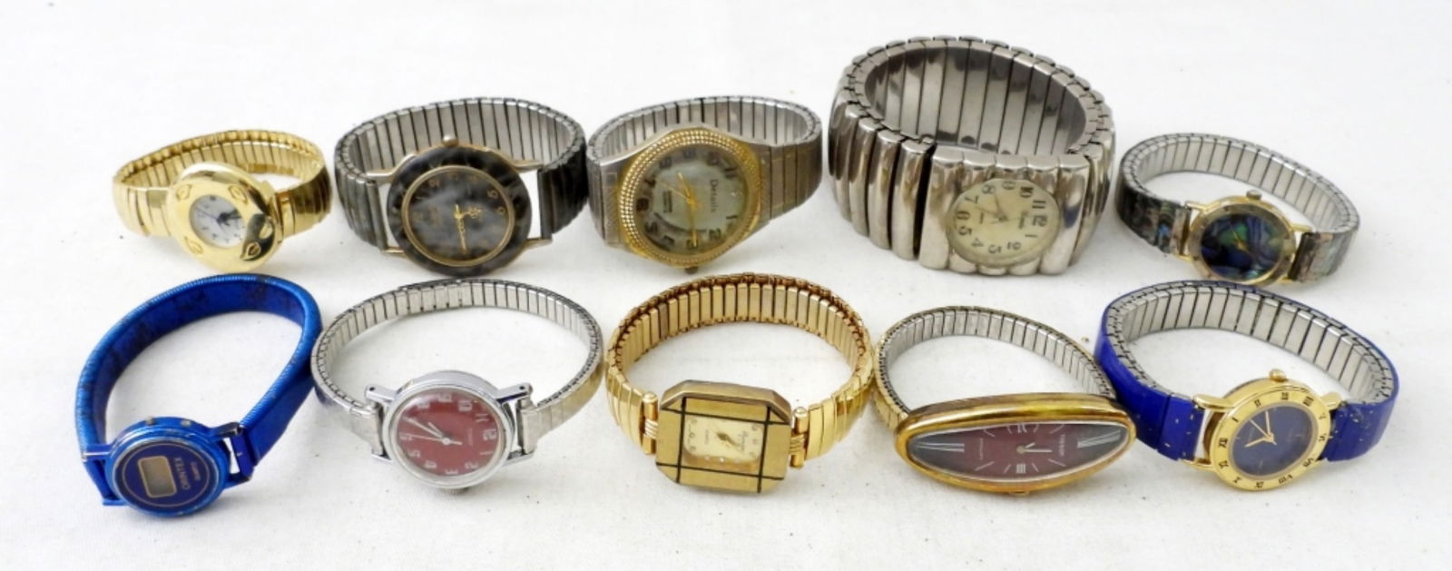 (10) LADIES STRETCHY BAND WATCHES: (10) LADIES STRETCHY BAND WATCHES.QUARTZ, TIMEX & MORE . VARIOUS COLORS AND STYLES. NOT TESTED AS TO WORKING OR NOT