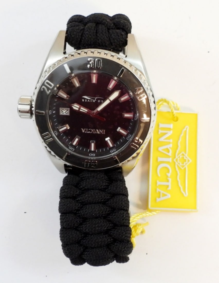 INVICTA PRO DIVER BLACK & SILVER MEN'S WATCH: INVICTA PRO DIVER WATCH WITH BLACK BRAIDED BAND, SILVER TONE FACE. MODEL # 26024. (CURRENTLY WORKING BUT NOT TESTED)
