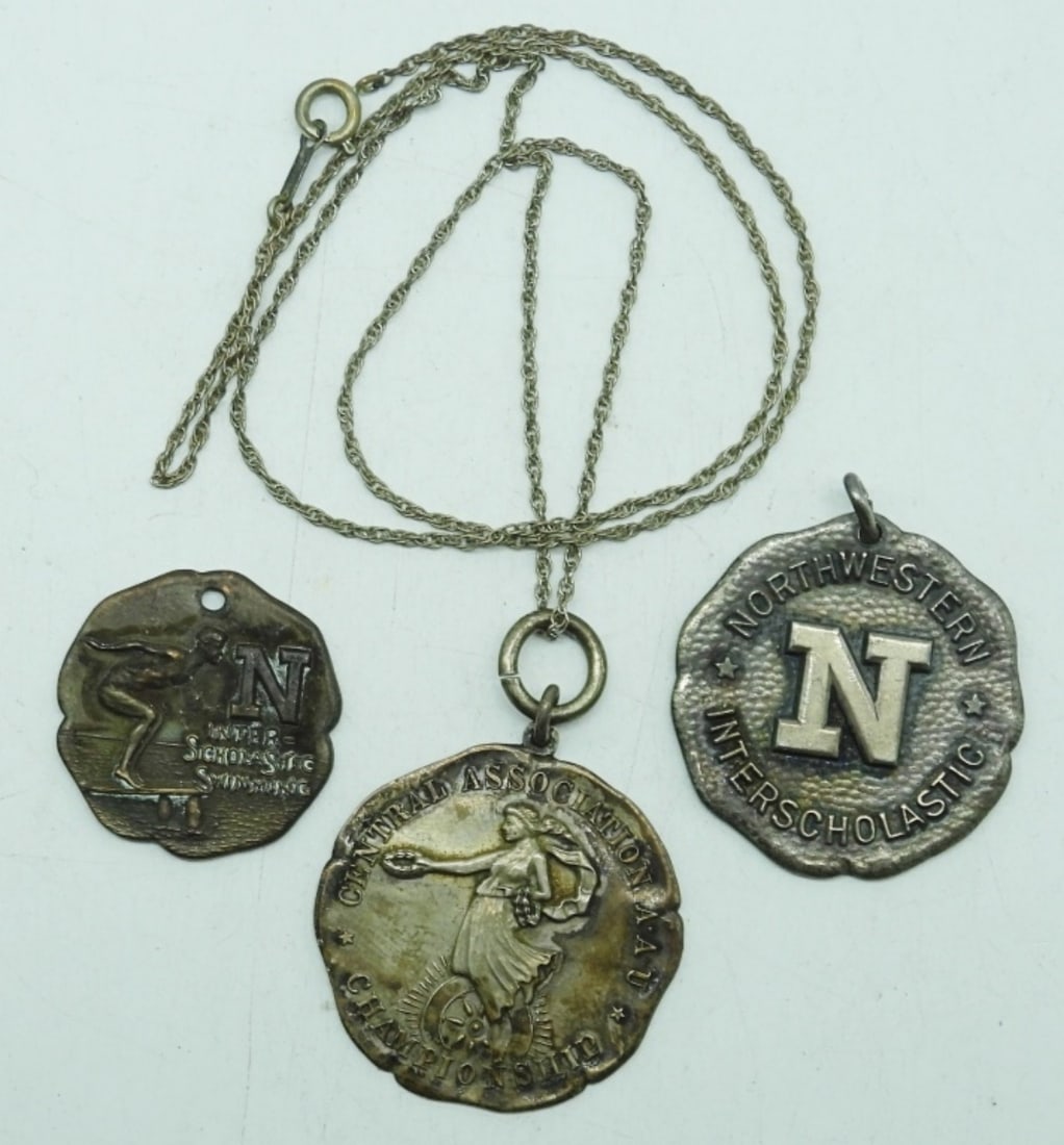 ANTIQUE NORTHWESTERN SWIMMING MEDALS: ANTIQUE STERLING "NORTHWESTERN" SWIM TEAM MEDALS. VERY COOL, ENGRAVED. CHAIN IS 20". 22.7 DWT