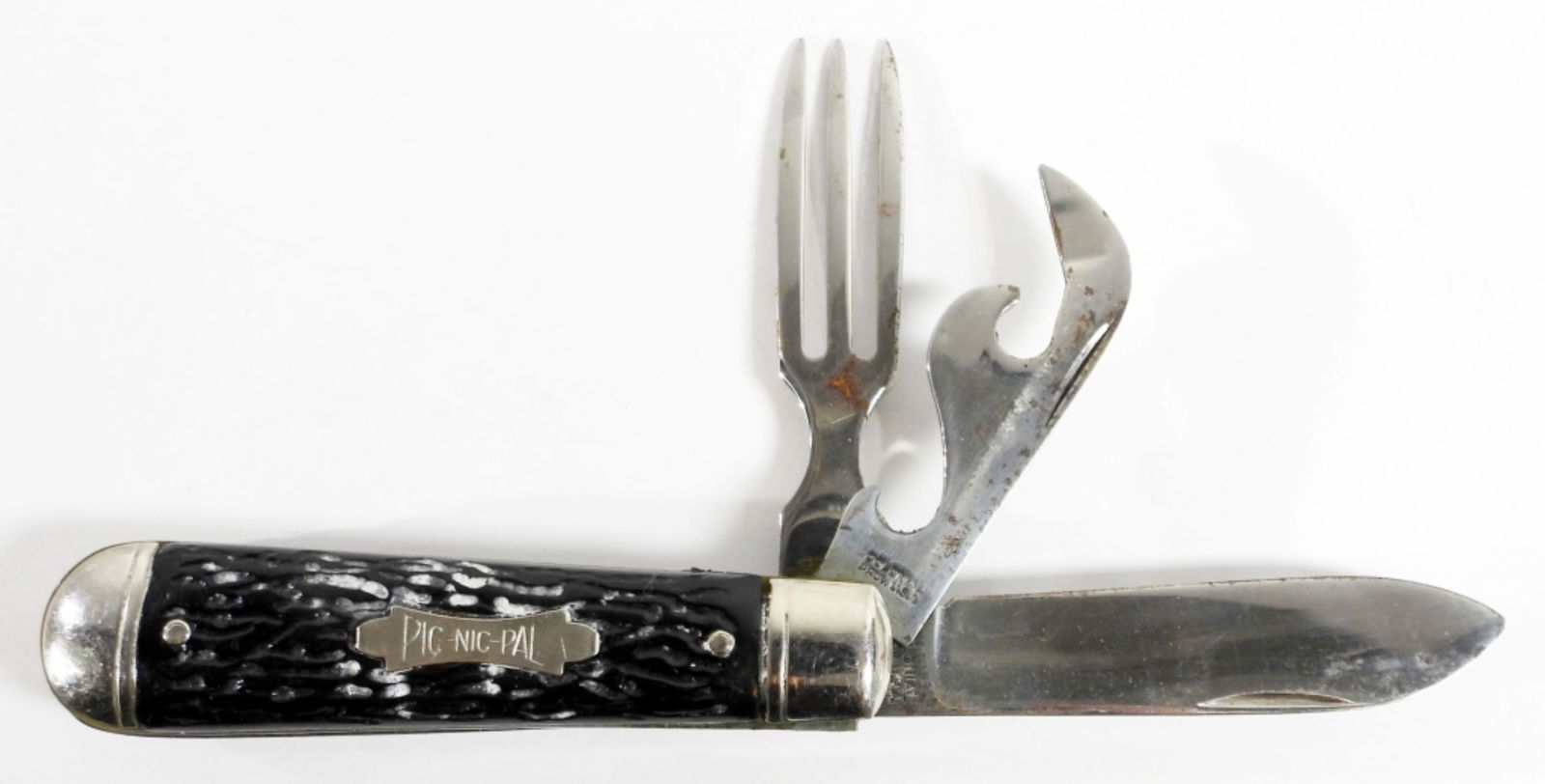 COLONIAL PROV.USA PIC NIC PAL POCKET KNIFE: COLONIAL PROV.USA PIC NIC PAL POCKET KNIFE. STAINLESS STEEL, SLIDE APART FORK HOBO CAMP KNIFE. 2 1/2 IN BLADE ,BLACK BONE LIKE HANDLE