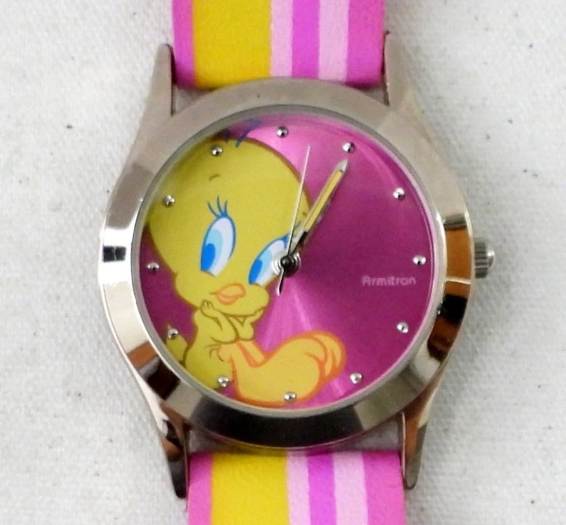 2006 AVON ARMITRON TWEETY WRIST WATCH: 2006 AVON ARMITRON TWEETY WRIST WATCH, PINK & YELLOW LEATHER LIKE BAND WITH A TWEETY FACE IN BOW. NOT TESTED AS TO WORKING OR NOT