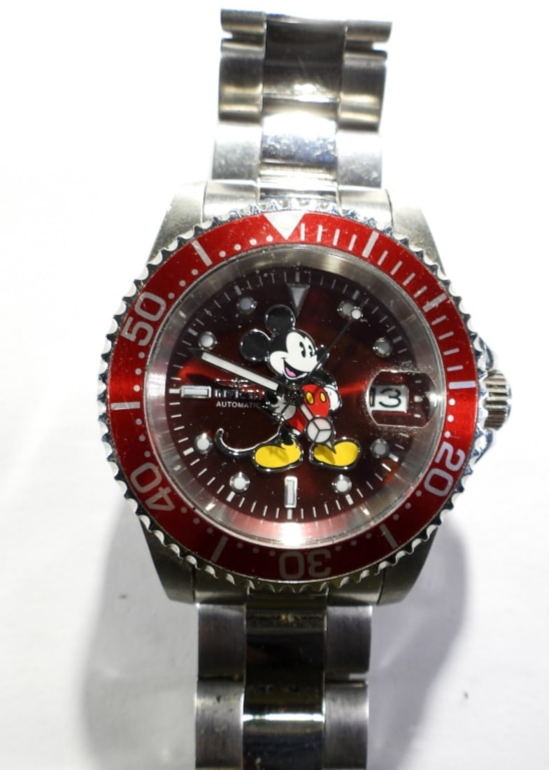 MENS INVICTA MICKEY MOUSE DATE WATCH: MENS INVICTA MICKEY MOUSE DATE WATCH. SILVER TONE STAINLESS STEEL, RED FACE WITH MICKEY MOUSE , CLASP BAND ( NOT TESTED AS TO WORKING OR NOT )
