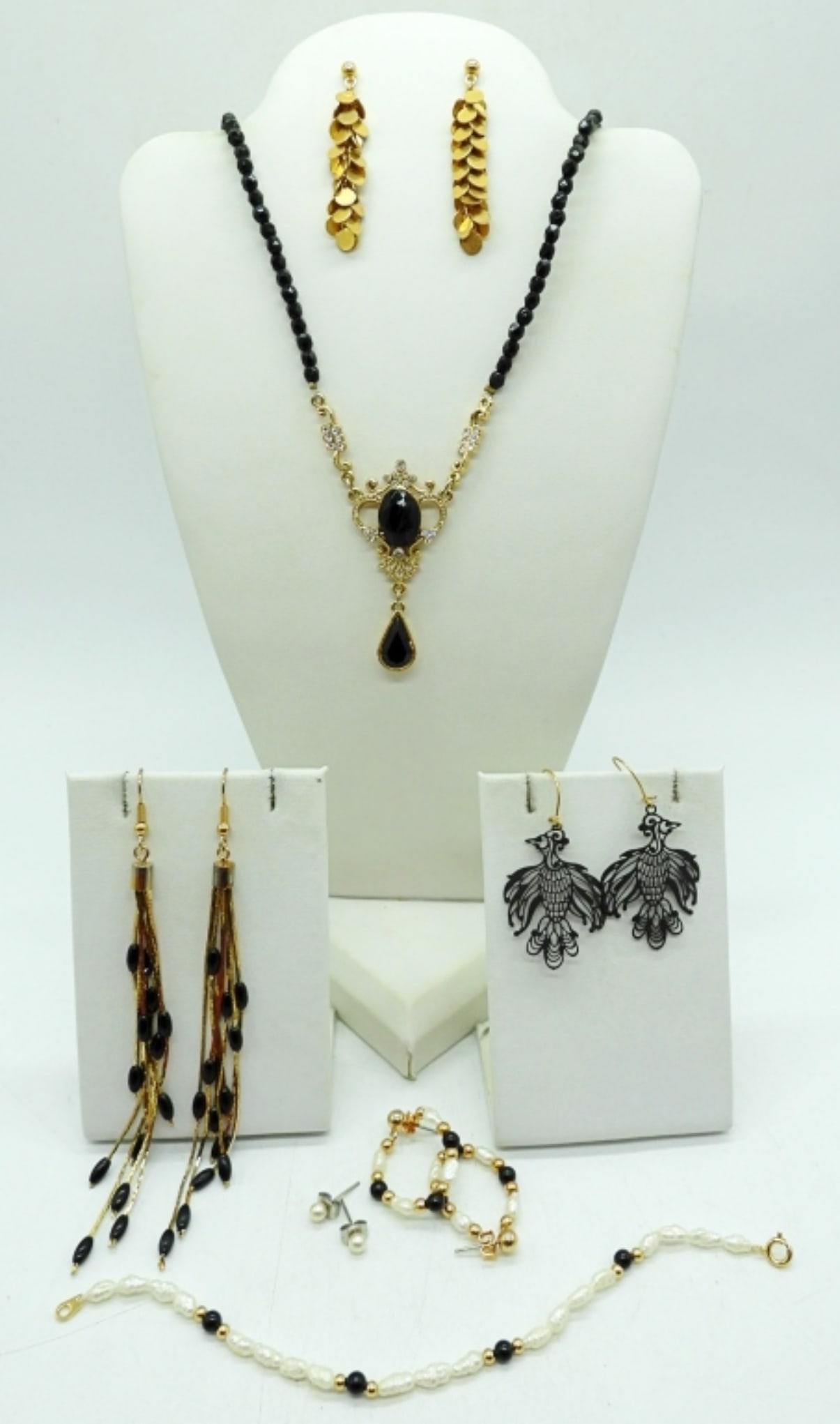 GOLD & BLACK FASHION JEWELRY: GOLD TONES, BLACK BEADS. NECKLACE, 18". FIVE PAIR PIERCED EARRINGS. BRACELET 7".