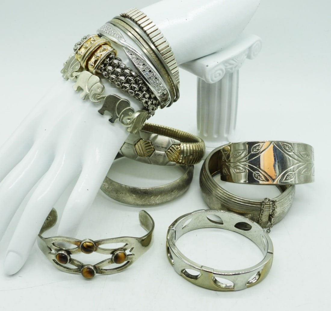 (11) SILVER TONE BRACELETS - FASHION: ELEVEN SILVER TONE FASHION BRACELETS. 6-8".