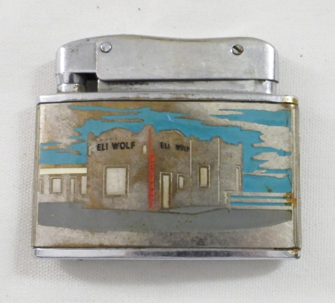 ELI WOLF INSURANCE CO, TEXAS AD FLAT: VINTAGE ADVERTISING LIGHTER - SOUTHWEST DESIGN - USED