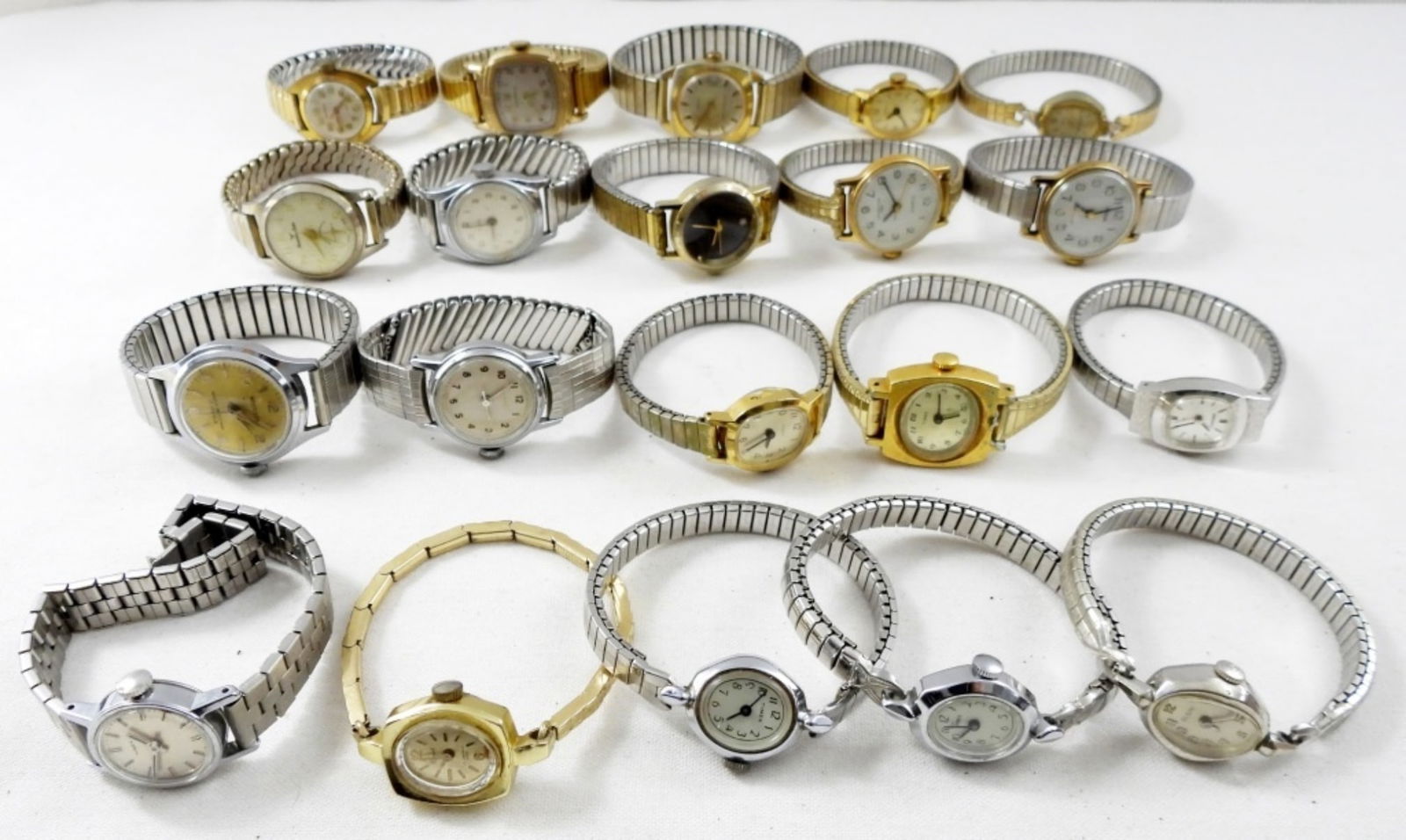 (20) VINTAGE STRETCHY BAND WATCHES: 20 STRETCHY BAND WATCHES. GOLD & SILVER TONES. MANHATTAN ELECTRA, TIMEX, WESTCLOX, ELGIN & MORE -NOT TESTED AS TO WORKING OR NOT!-
