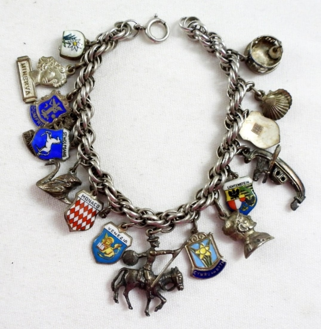STERLING CHARM BRACELET: 30DWT, 16 CHARMS MOST ARE MARKED STERLING OR 925, 7IN LONG