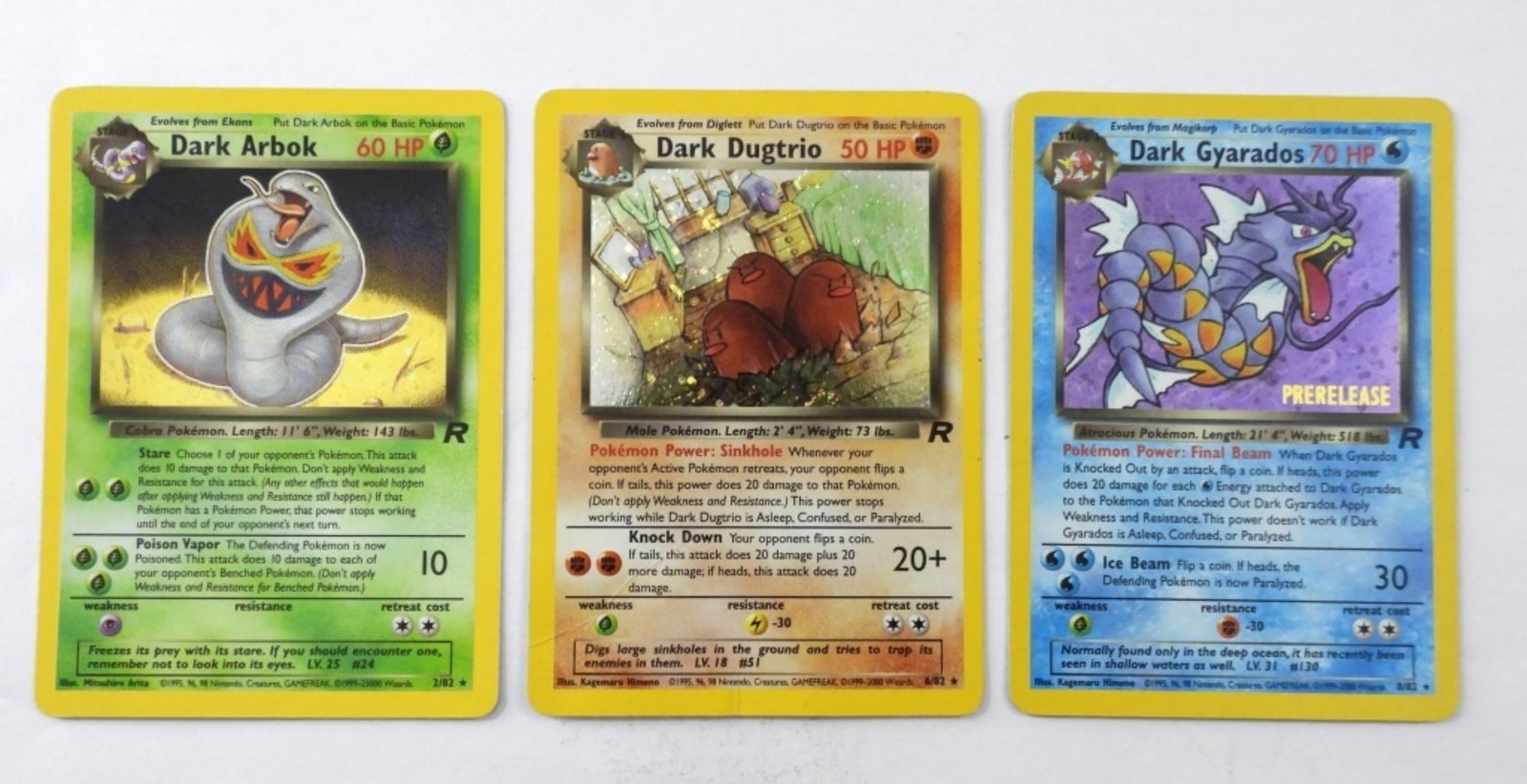 CARK DUGTRIO, ARBOK, GYARADOS HOLO: DARK DUGTRIO 50 HP 6/82 HOLO, DARK ARBOK 60 HP 2/82 HOLO, DARK GYARADOS 70 HP 8/82 HOLO. ALL IN GOOD CONDITION.