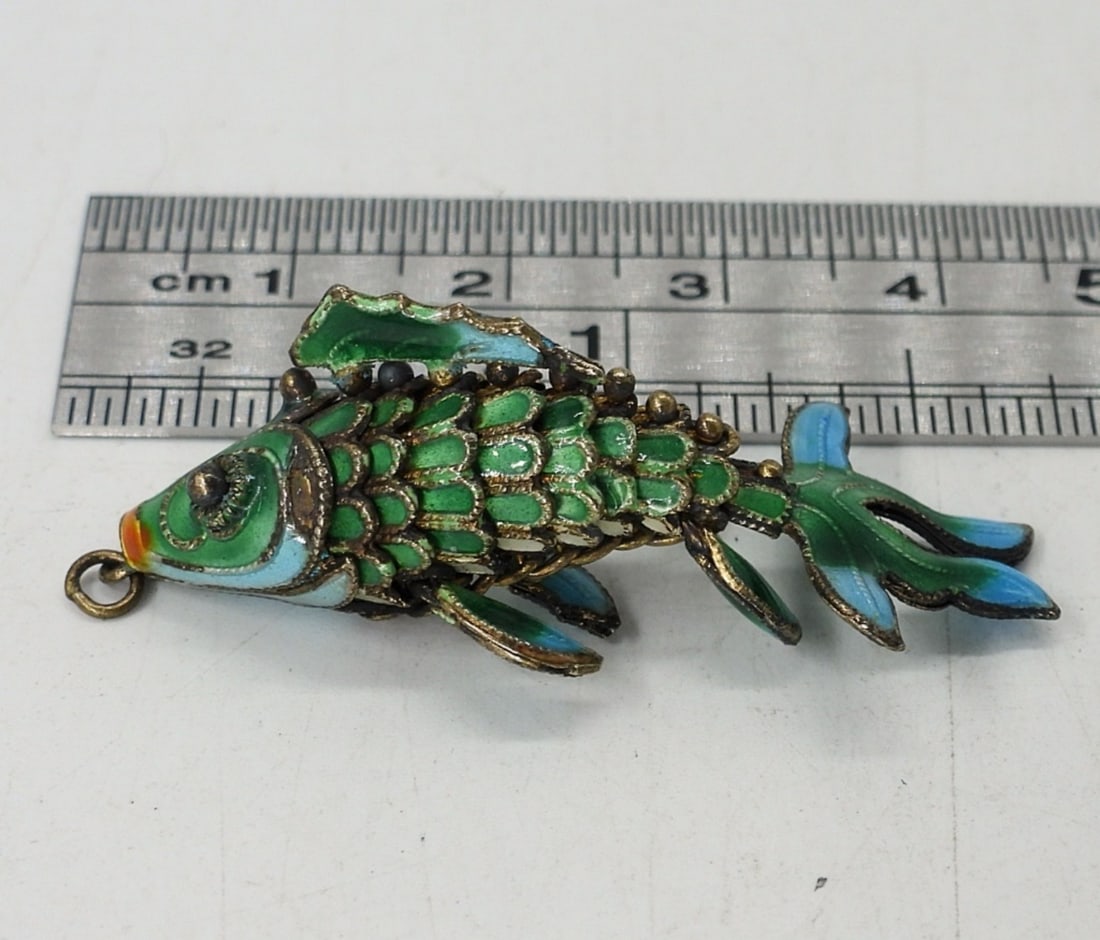TINY CLOISONNE KOI FISH PENDANT: TINY CLOISONNE GREEN & BLUE ARTICULATED FISH PENDANT.