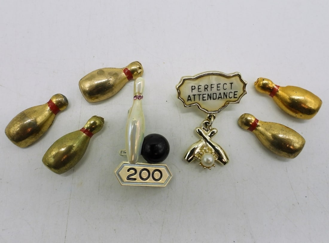 (7) VINTAGE BOWLING BROOCHES: SEVEN LADIES BOWLING PIN BROOCHES. VERY NEAT.