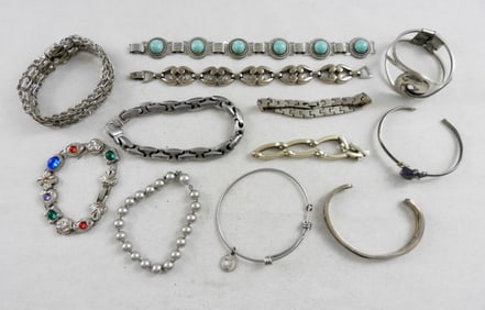 SILVER TONE BRACELETS (12)