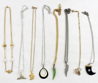7 ASSORTED PENDANTS ON CHAINS