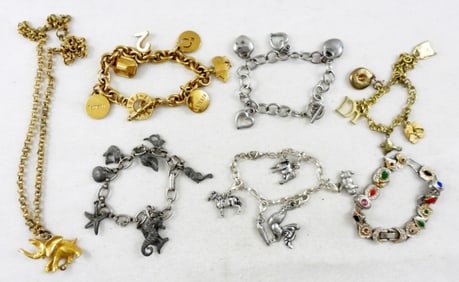 6 CHARM BRACELETS & ELEPHANT NECKLACE