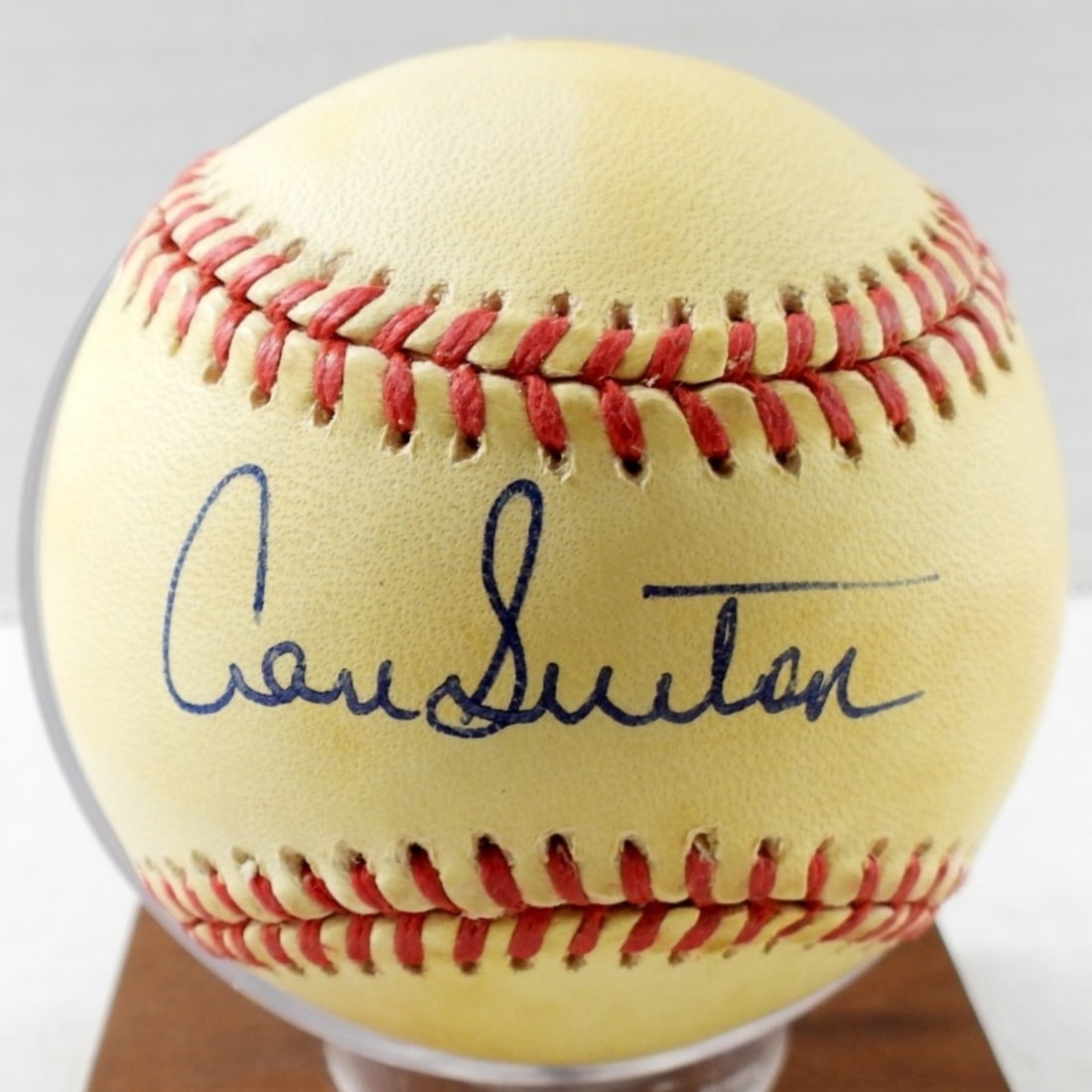 DON SUTTON AUTOGRAPH BASEBALL: AMERICAN LEAGUE BALL - with WOOD BASE BALL HOLDER needs screw replaced - NO COA