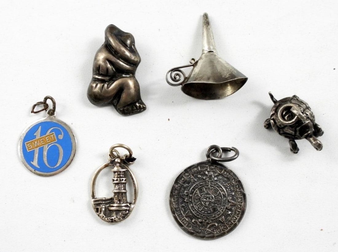 UNUSUAL STERLING LOT: TURTLE, LIGHTHOUSE: AZTEC CALENDAR, SWEET 16, SMALL TINY FUNNEL & SLEEPING SOMBARO BUTTON (13 DWT)